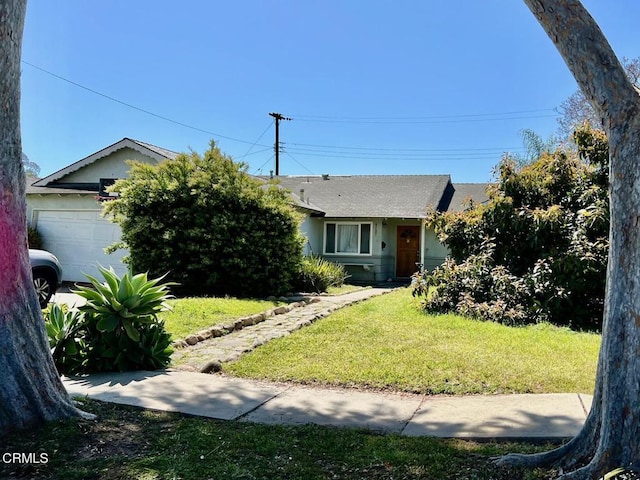 4723 Frazier Ln, Santa Barbara, CA 93110 - view of front of house featuring an attached garage, a front yard, and stucco siding