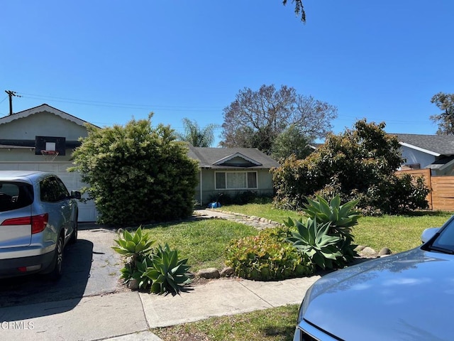 4723 Frazier Ln, Santa Barbara, CA 93110 - obstructed view of property featuring a front yard and a garage