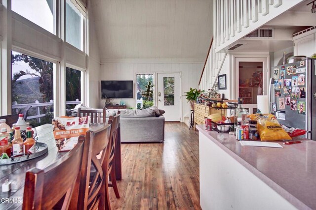 5500 Casitas Pass Rd, Ventura, CA 93001 - dining area with high vaulted ceiling, hardwood / wood-style floors, and stairs