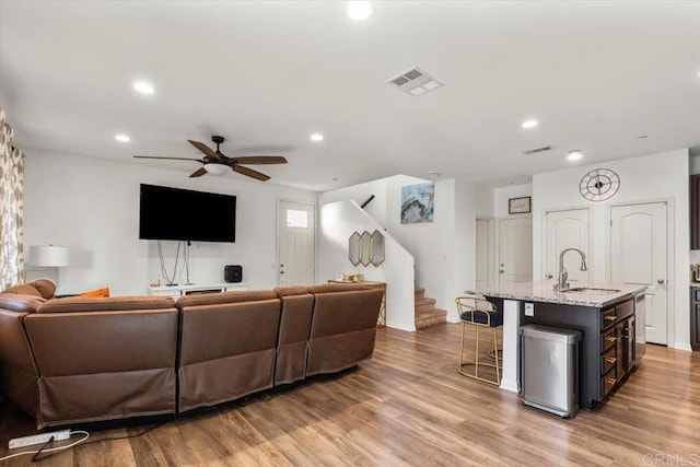 861 Colton Ave, Colton, CA 92324 - living area featuring a ceiling fan, recessed lighting, light wood-type flooring, and stairway