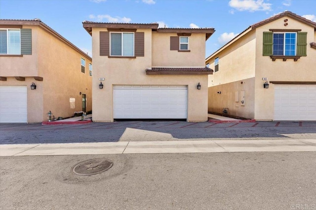 861 Colton Ave, Colton, CA 92324 - view of front of property featuring stucco siding, an attached garage, and a tile roof