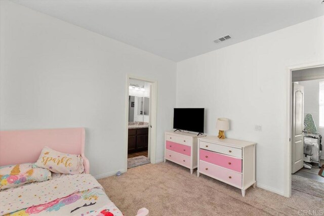861 Colton Ave, Colton, CA 92324 - bedroom with light carpet, ensuite bath, and baseboards