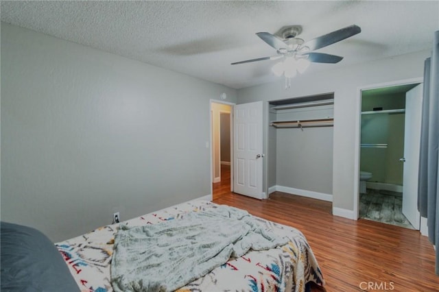 5805 Vista Del Cerro, Oroville, CA 95966 - bedroom with wood finished floors, a closet, a ceiling fan, baseboards, and ensuite bath