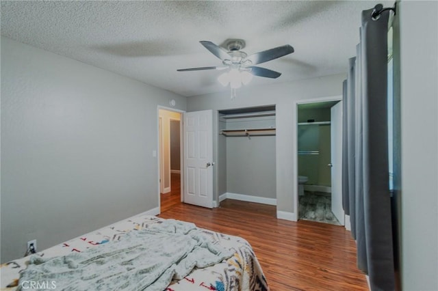 5805 Vista Del Cerro, Oroville, CA 95966 - bedroom with wood finished floors, baseboards, a ceiling fan, a textured ceiling, and ensuite bath