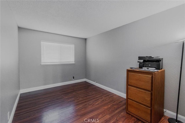 5805 Vista Del Cerro, Oroville, CA 95966 - unfurnished bedroom featuring wood finished floors, a textured ceiling, and baseboards
