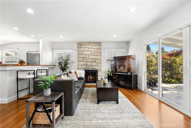 3007 Killybrooke Ln, Costa Mesa, CA 92626 - living area with wood finished floors, plenty of natural light, recessed lighting, and a fireplace