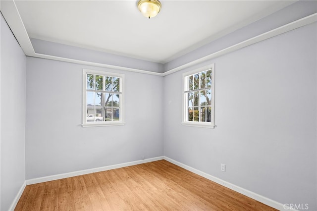 10441 La Mirada Blvd, Whittier, CA 90604 - spare room with healthy amount of natural light, wood finished floors, and baseboards