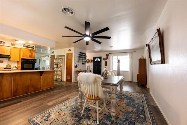 3080 State Highway 45, Glenn, CA 95943 - dining space featuring dark wood-style flooring, ceiling fan, and baseboards