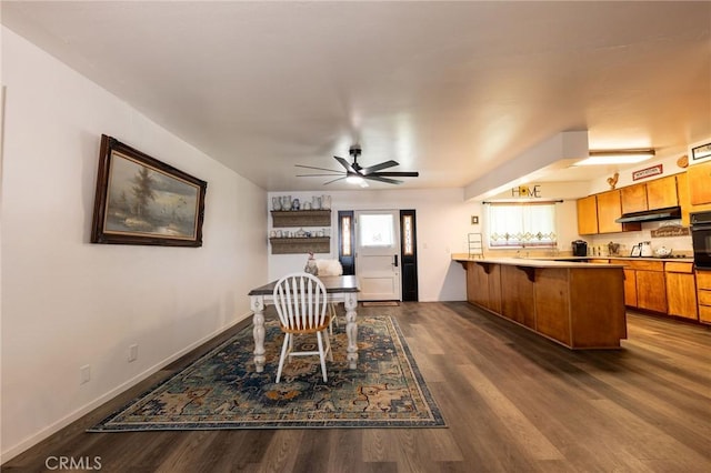 3080 State Highway 45, Glenn, CA 95943 - dining area with dark wood-type flooring, baseboards, and a ceiling fan