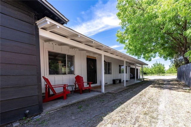 3080 State Highway 45, Glenn, CA 95943 - view of home's exterior with board and batten siding, fence, and a patio area