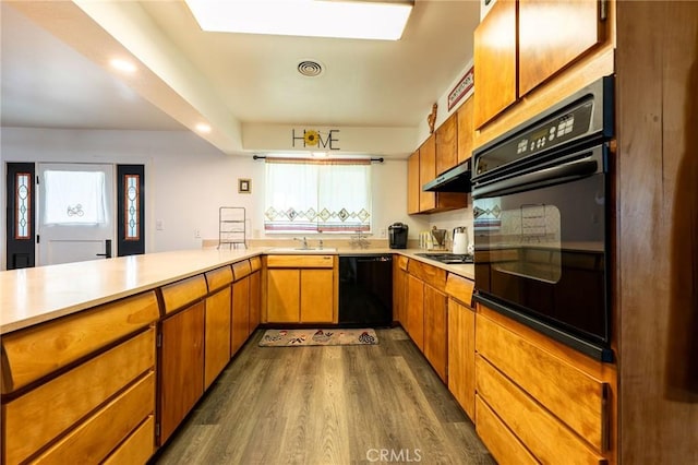 3080 State Highway 45, Glenn, CA 95943 - kitchen featuring black appliances, dark wood-type flooring, light countertops, a sink, and under cabinet range hood