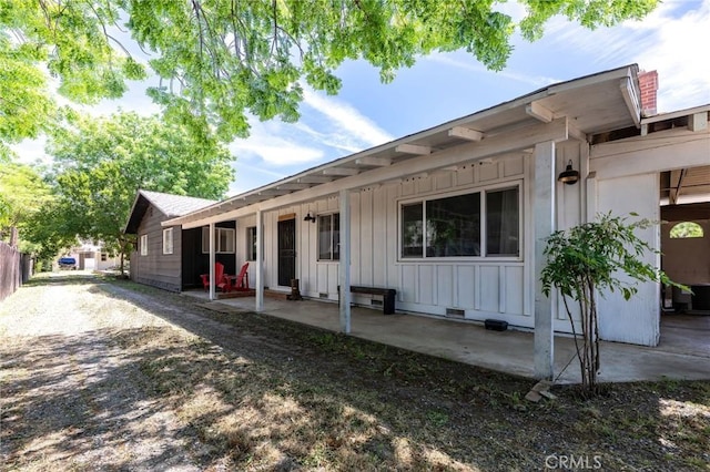 3080 State Highway 45, Glenn, CA 95943 - rear view of house featuring board and batten siding and a patio