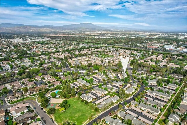 101 Briarwood Unit 3, Irvine, CA 92604 - aerial overview of property's location with a mountainous background and nearby suburban area