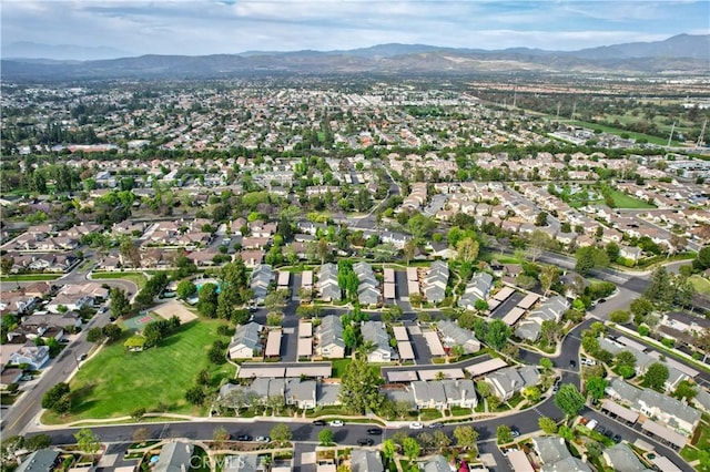 101 Briarwood Unit 3, Irvine, CA 92604 - aerial overview of property's location featuring a mountain backdrop and nearby suburban area
