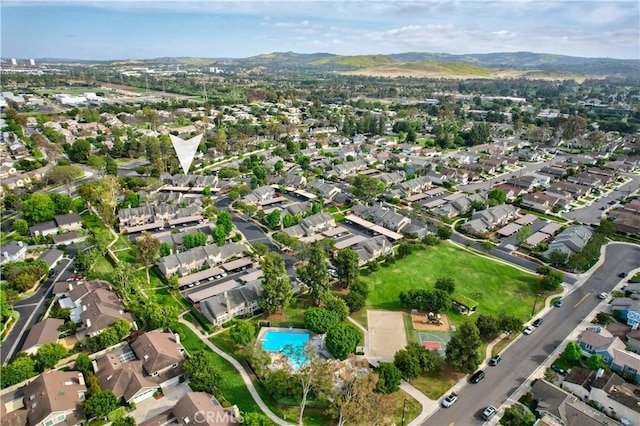 101 Briarwood Unit 3, Irvine, CA 92604 - aerial view of property and surrounding area featuring a mountain backdrop and nearby suburban area