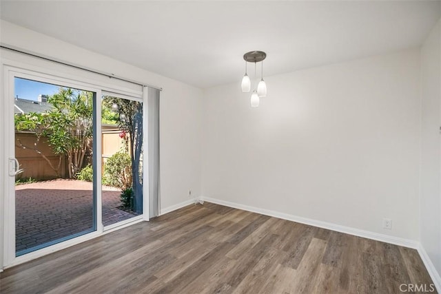 101 Briarwood Unit 3, Irvine, CA 92604 - empty room featuring wood finished floors and baseboards