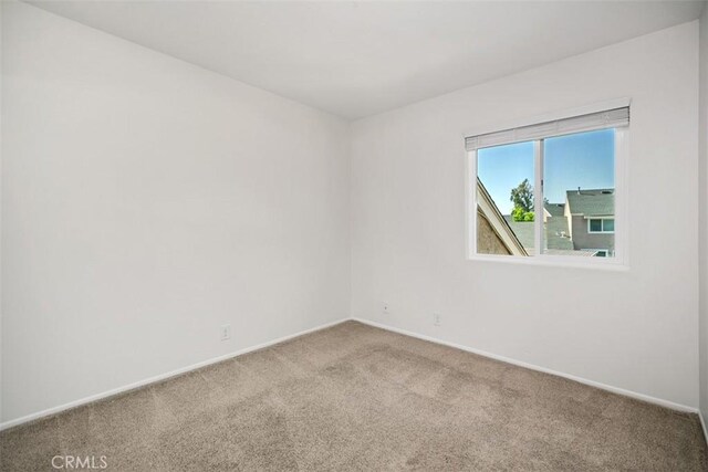 101 Briarwood Unit 3, Irvine, CA 92604 - carpeted empty room featuring baseboards