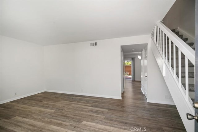 101 Briarwood Unit 3, Irvine, CA 92604 - unfurnished living room featuring wood finished floors and stairway