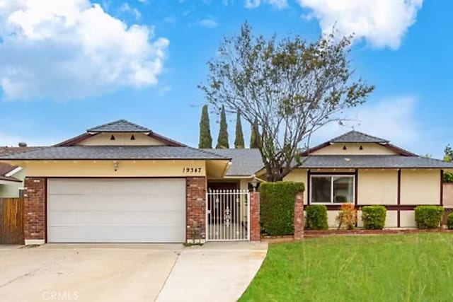 19347 Andrada Dr, Rowland Heights, CA 91748 - single story home with driveway, a garage, and brick siding