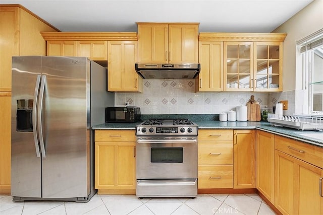 19347 Andrada Dr, Rowland Heights, CA 91748 - kitchen with appliances with stainless steel finishes, under cabinet range hood, dark countertops, tasteful backsplash, and glass insert cabinets