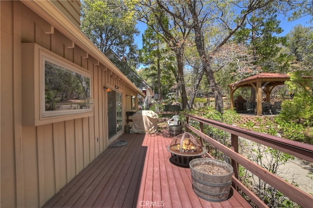 1249 Yellowstone Dr, Lake Arrowhead, CA 92352 - deck with a fire pit, a gazebo, and grilling area
