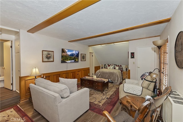1249 Yellowstone Dr, Lake Arrowhead, CA 92352 - bedroom featuring wood finished floors, a textured ceiling, beam ceiling, a wainscoted wall, and wooden walls