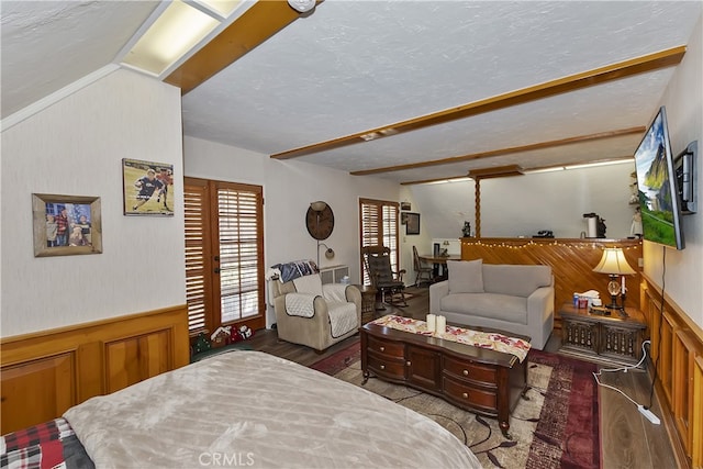 1249 Yellowstone Dr, Lake Arrowhead, CA 92352 - bedroom with wood finished floors, wainscoting, a textured ceiling, and wooden walls