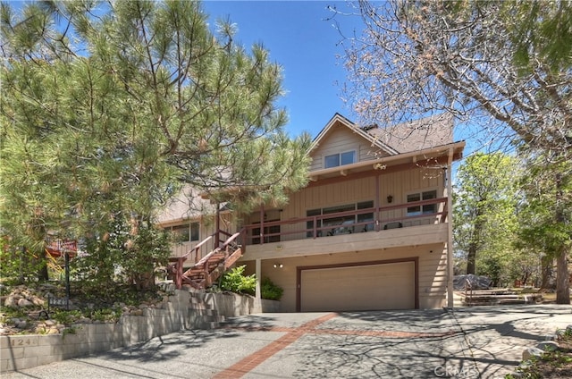 1249 Yellowstone Dr, Lake Arrowhead, CA 92352 - rustic home with an attached garage, driveway, and stairs