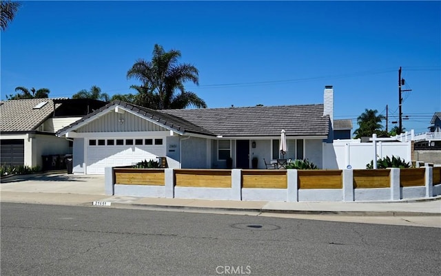 21651 Hilaria, Huntington Beach, CA 92646 - ranch-style house featuring a fenced front yard, a garage, concrete driveway, a chimney, and a tile roof