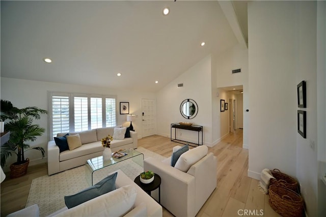 21651 Hilaria, Huntington Beach, CA 92646 - living room with high vaulted ceiling, beam ceiling, light wood finished floors, recessed lighting, and baseboards