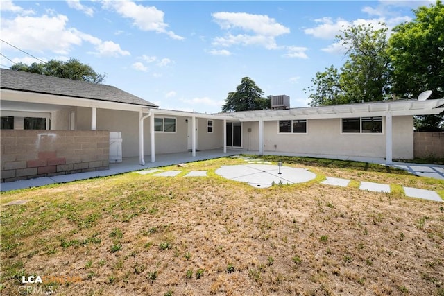 3113 Occidental St, Bakersfield, CA 93305 - back of house with a patio area, stucco siding, a pergola, and central AC unit