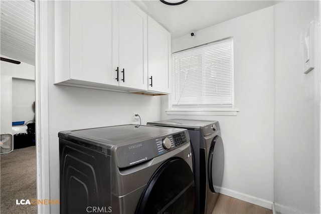 3113 Occidental St, Bakersfield, CA 93305 - clothes washing area featuring separate washer and dryer, cabinet space, and baseboards