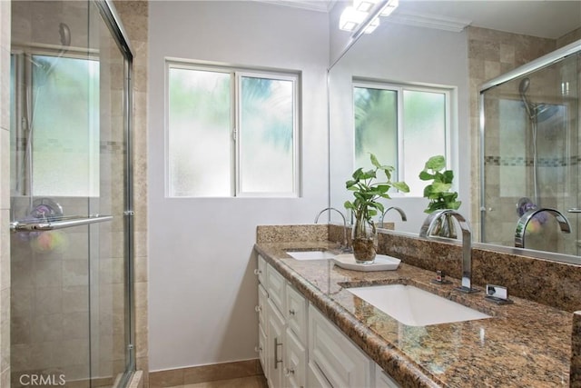3950 E De Ora Way, Long Beach, CA 90815 - full bathroom featuring a shower stall, double vanity, ornamental molding, and tile patterned floors