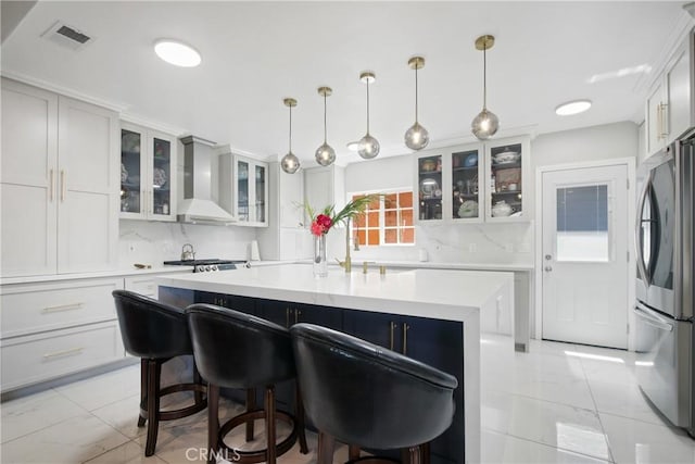 3950 E De Ora Way, Long Beach, CA 90815 - kitchen with smart refrigerator, wall chimney exhaust hood, tasteful backsplash, and light countertops
