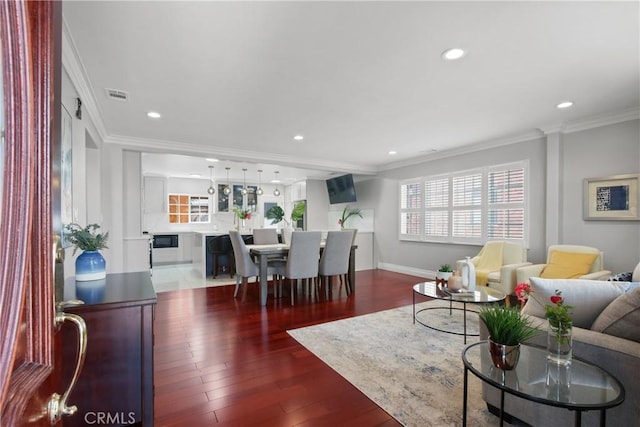 3950 E De Ora Way, Long Beach, CA 90815 - living area featuring crown molding, recessed lighting, wood finished floors, and baseboards