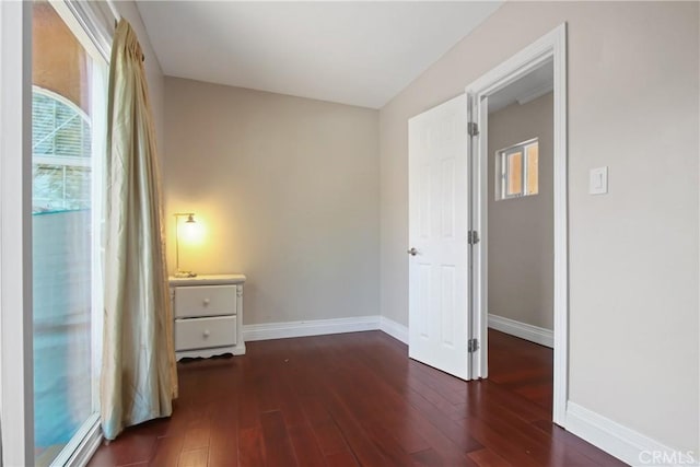 3950 E De Ora Way, Long Beach, CA 90815 - unfurnished bedroom featuring wood-type flooring and baseboards