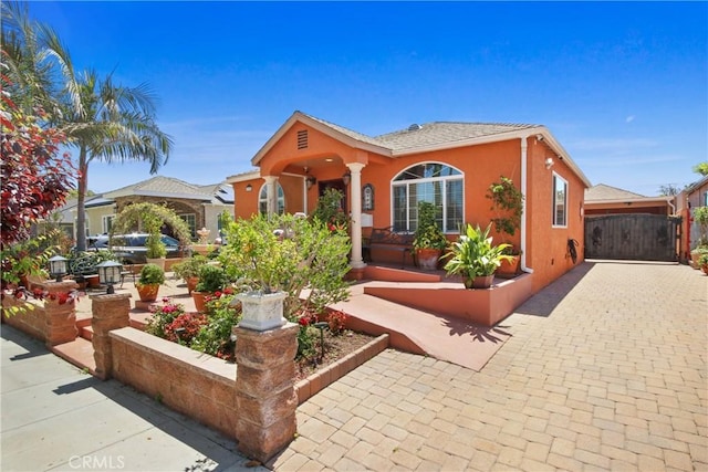 3950 E De Ora Way, Long Beach, CA 90815 - view of front of property featuring stucco siding and a gate