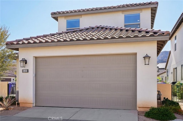 80218 Whisper Rock Way, La Quinta, CA 92253 - garage with concrete driveway and fence