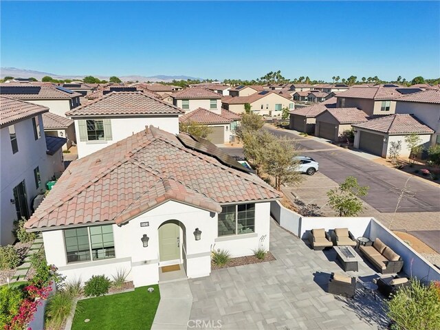 80218 Whisper Rock Way, La Quinta, CA 92253 - mediterranean / spanish-style home with a residential view, a tile roof, and stucco siding