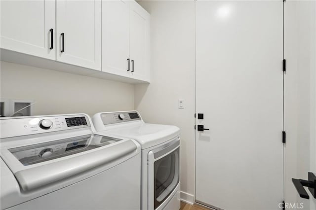 80218 Whisper Rock Way, La Quinta, CA 92253 - clothes washing area featuring cabinet space and washing machine and clothes dryer