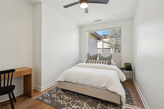 80218 Whisper Rock Way, La Quinta, CA 92253 - bedroom with wood finished floors, baseboards, and ceiling fan
