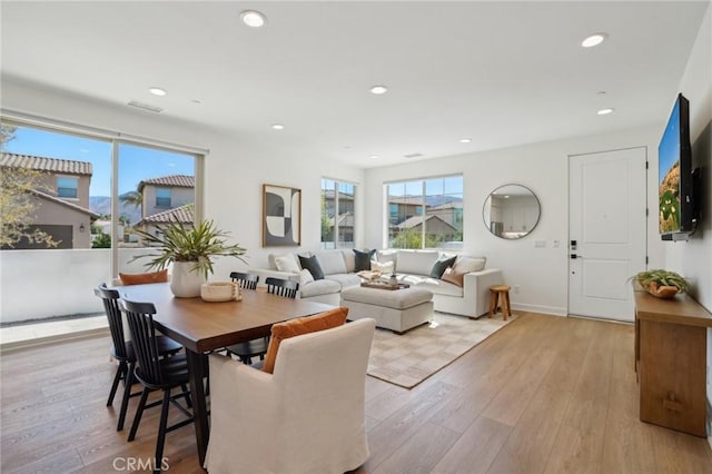 80218 Whisper Rock Way, La Quinta, CA 92253 - dining room featuring healthy amount of natural light, recessed lighting, and light wood-style floors