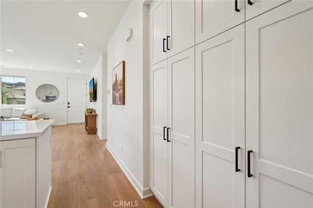80218 Whisper Rock Way, La Quinta, CA 92253 - hallway with recessed lighting, light wood-type flooring, and baseboards