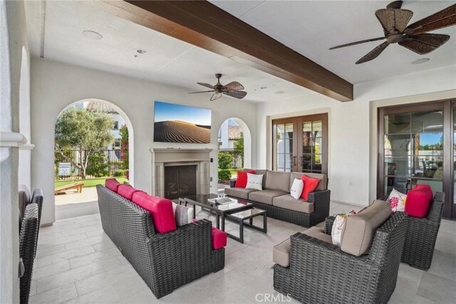 80218 Whisper Rock Way, La Quinta, CA 92253 - view of patio / terrace featuring ceiling fan, an outdoor living space with a fireplace, and french doors