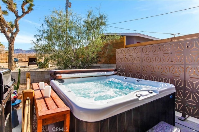 61475 Alta Vista Dr, Joshua Tree, CA 92252 - wooden terrace with a hot tub, a fenced backyard, and a mountain view