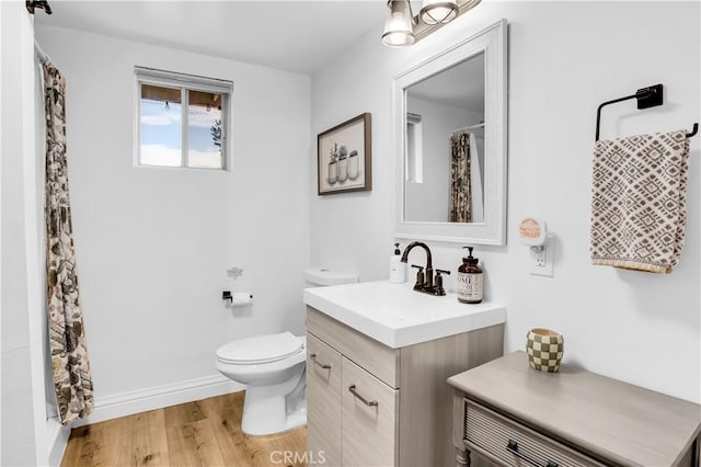 61475 Alta Vista Dr, Joshua Tree, CA 92252 - full bath with toilet, vanity, wood finished floors, a shower with curtain, and baseboards