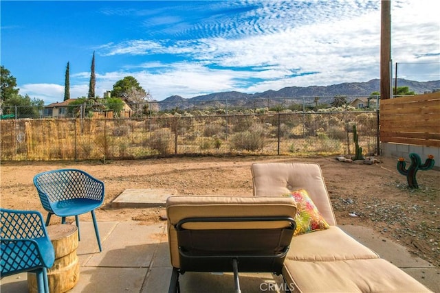 61475 Alta Vista Dr, Joshua Tree, CA 92252 - view of patio featuring a mountain view and fence