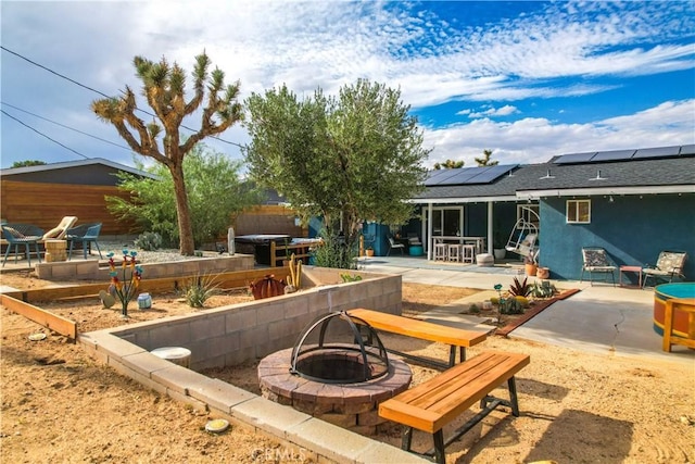 61475 Alta Vista Dr, Joshua Tree, CA 92252 - view of patio with an outdoor fire pit, outdoor dining space, and a vegetable garden