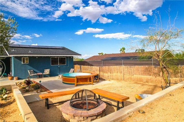 61475 Alta Vista Dr, Joshua Tree, CA 92252 - view of patio with a fire pit, a hot tub, and a fenced backyard