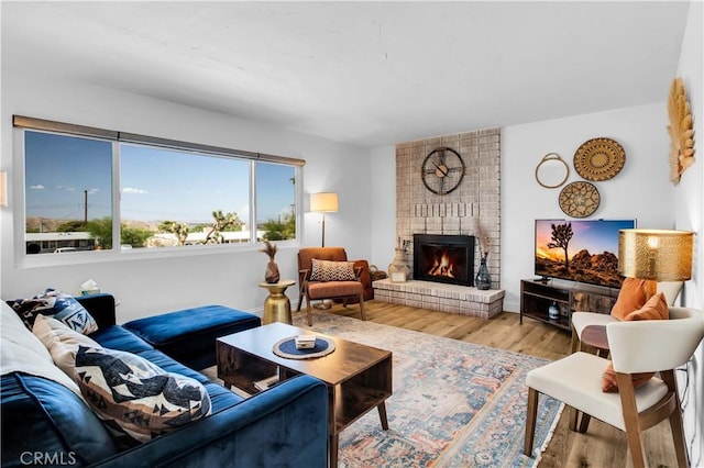 61475 Alta Vista Dr, Joshua Tree, CA 92252 - living room with wood finished floors and a brick fireplace
